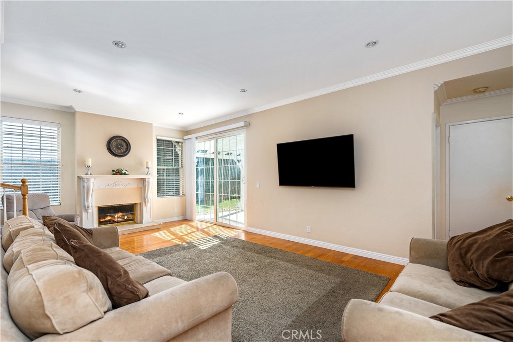 2508 Royale Place Fullerton, CA 92833 - Photo 21 of 53 a living room with furniture a flat screen tv and a fireplace