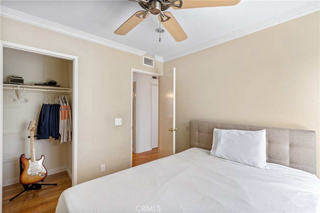 2508 Royale Place Fullerton, CA 92833 - Photo 25 of 53 a bedroom with a bed and a chandelier