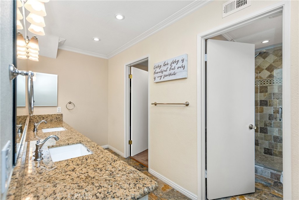 2508 Royale Place Fullerton, CA 92833 - Photo 29 of 53 a view of a hallway with bathroom and mirror