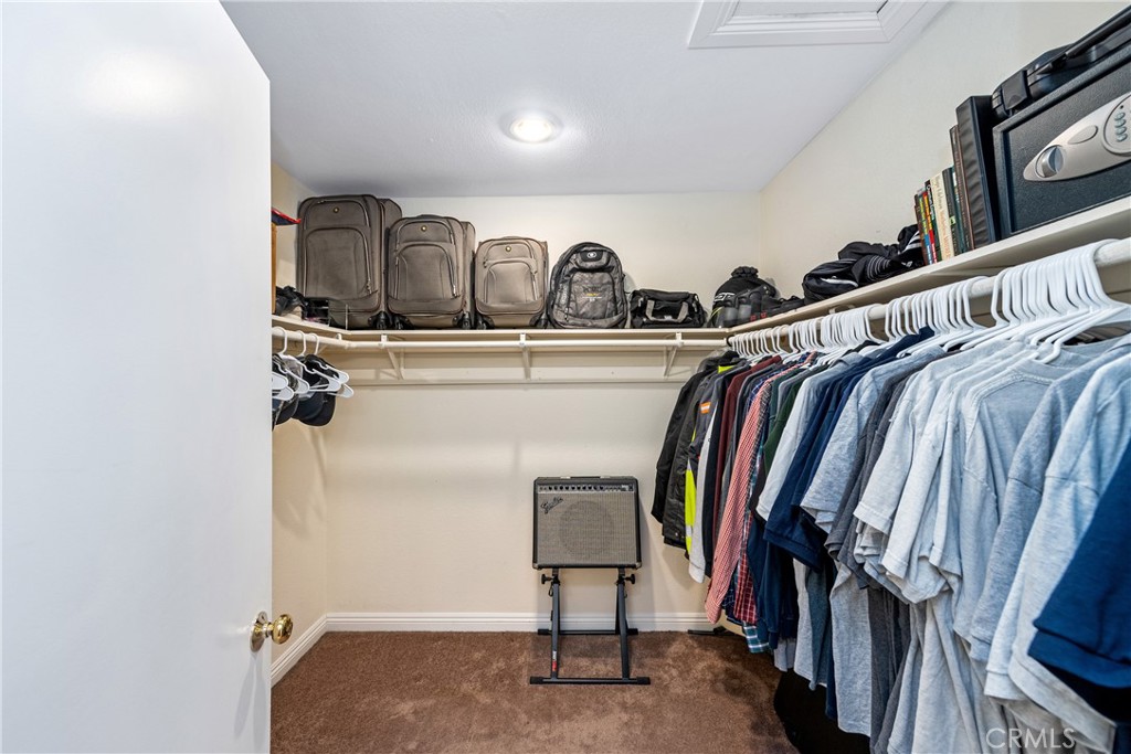 2508 Royale Place Fullerton, CA 92833 - Photo 37 of 53 a view of walk in closet with clothes and shoes