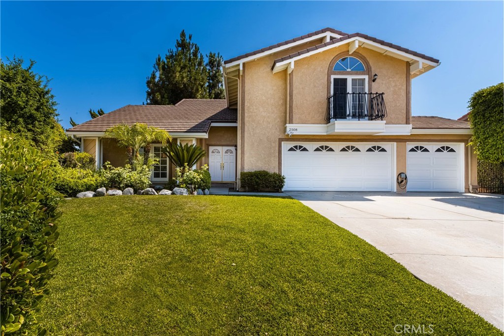 2508 Royale Place Fullerton, CA 92833 - Photo 52 of 53 a front view of a house with a yard