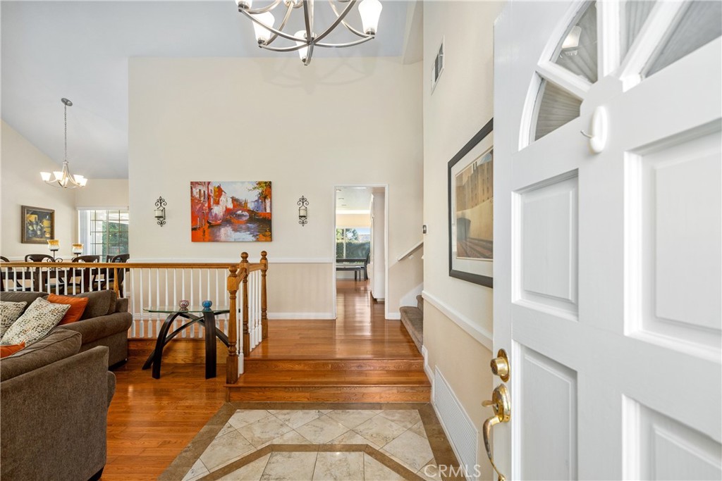2508 Royale Place Fullerton, CA 92833 - Photo 7 of 53 a view of a hallway with wooden floor and dining room
