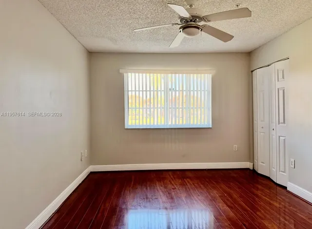 a kitchen with a refrigerator and a stove