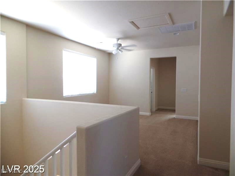 118 Castle Course Avenue Las Vegas, NV 89148 - Photo 11 of 56 Hallway featuring an upstairs landing and carpet floors