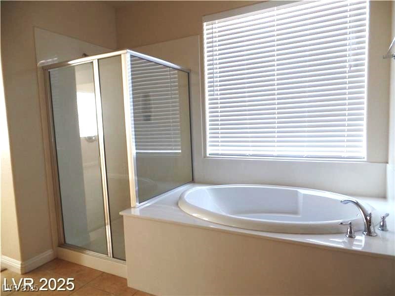 118 Castle Course Avenue Las Vegas, NV 89148 - Photo 16 of 56 Bathroom with a shower stall, a garden tub, and light tile patterned floors