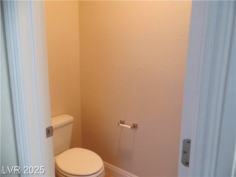 118 Castle Course Avenue Las Vegas, NV 89148 - Photo 17 of 56 Bathroom with baseboards and toilet