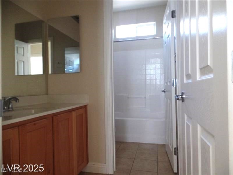 118 Castle Course Avenue Las Vegas, NV 89148 - Photo 21 of 56 Full bathroom with vanity, light tile patterned floors, and shower / bath combination