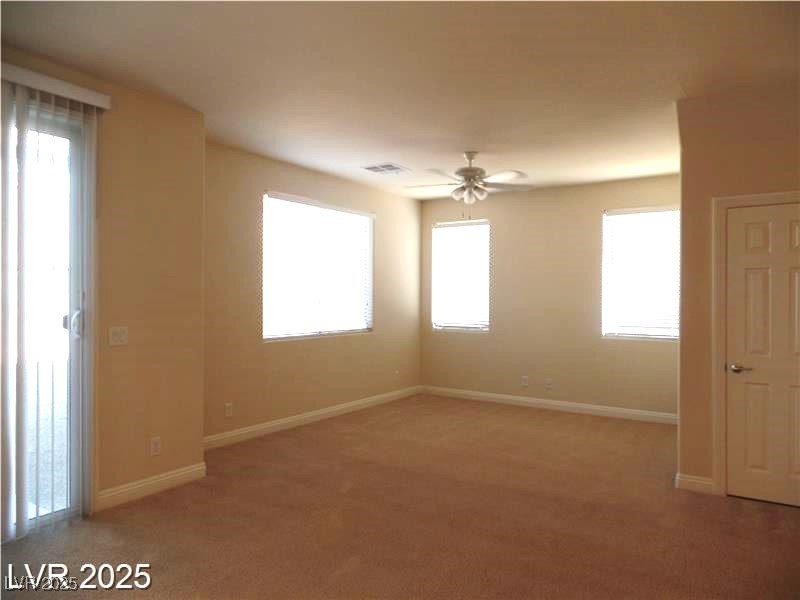 118 Castle Course Avenue Las Vegas, NV 89148 - Photo 8 of 56 Spare room with light carpet and ceiling fan