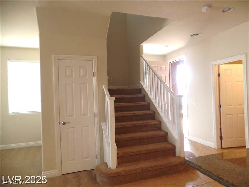 118 Castle Course Avenue Las Vegas, NV 89148 - Photo 9 of 56 Stairway featuring tile patterned flooring and plenty of natural light