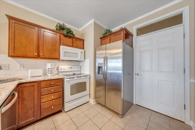 a kitchen with stainless steel appliances granite countertop a stove and a sink