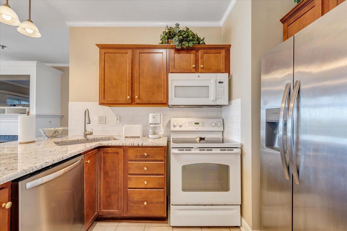 1273 Graves Harbor Trail, Unit 347 Huddleston, VA 24104 - Photo 12 of 63 a kitchen with stainless steel appliances granite countertop a refrigerator and a stove top oven