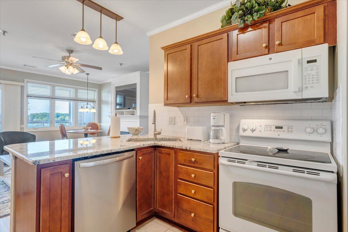 1273 Graves Harbor Trail, Unit 347 Huddleston, VA 24104 - Photo 14 of 63 a kitchen with granite countertop a sink stainless steel appliances and cabinets