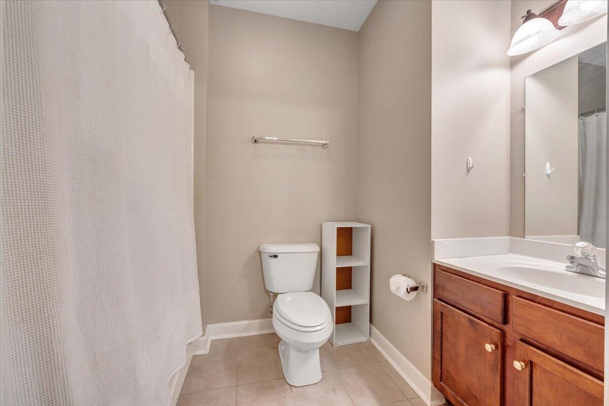1273 Graves Harbor Trail, Unit 347 Huddleston, VA 24104 - Photo 20 of 63 a bathroom with a toilet a sink and mirror