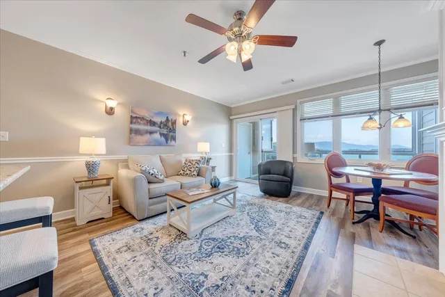 a living room with furniture fireplace and window