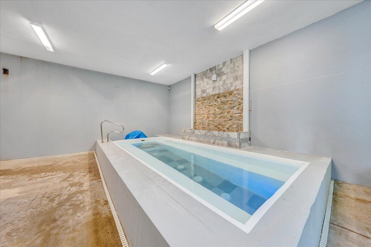 1273 Graves Harbor Trail, Unit 347 Huddleston, VA 24104 - Photo 59 of 63 a bed sitting in a room next to a window