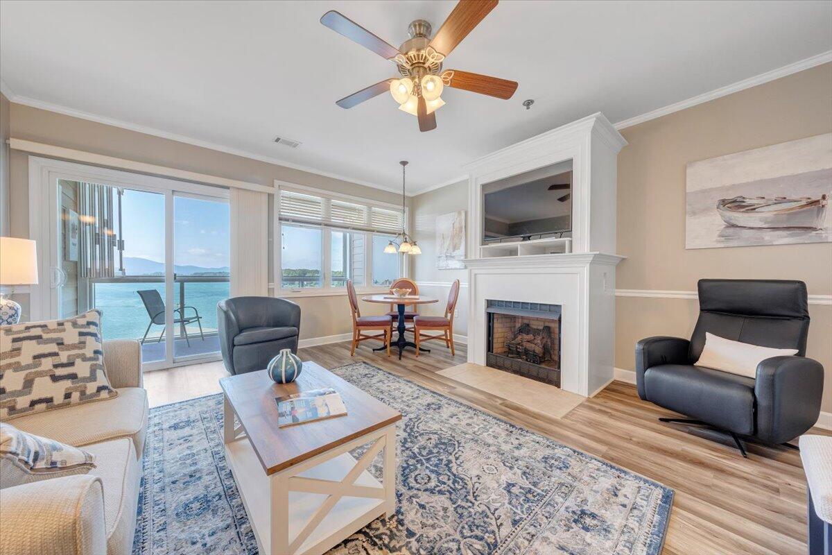 1273 Graves Harbor Trail, Unit 347 Huddleston, VA 24104 - Photo 6 of 63 a living room with furniture a flat screen tv and a fireplace