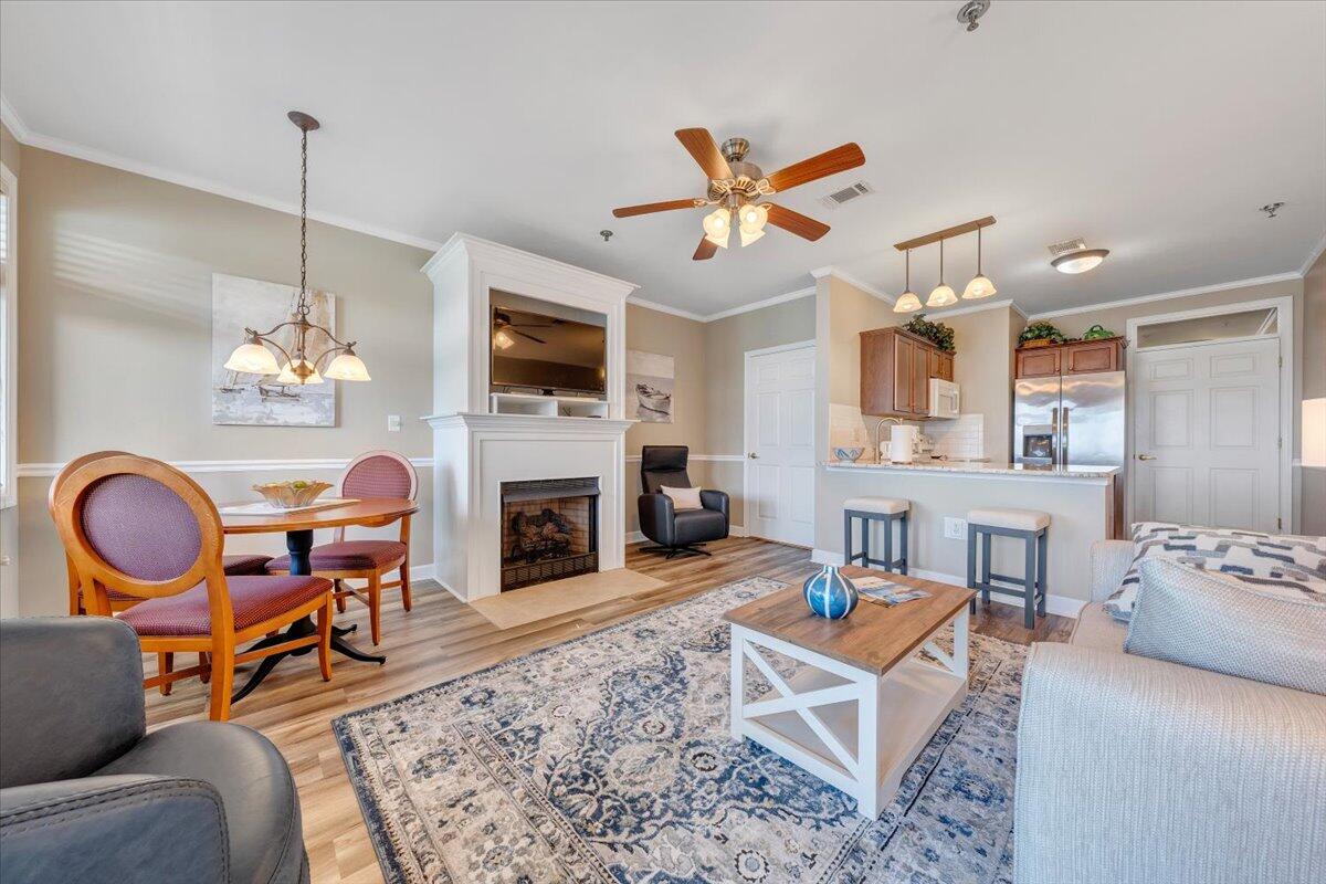 1273 Graves Harbor Trail, Unit 347 Huddleston, VA 24104 - Photo 8 of 63 a living room with furniture a fireplace and a flat screen tv