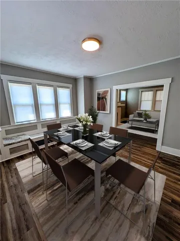 a living room with furniture a rug and a window