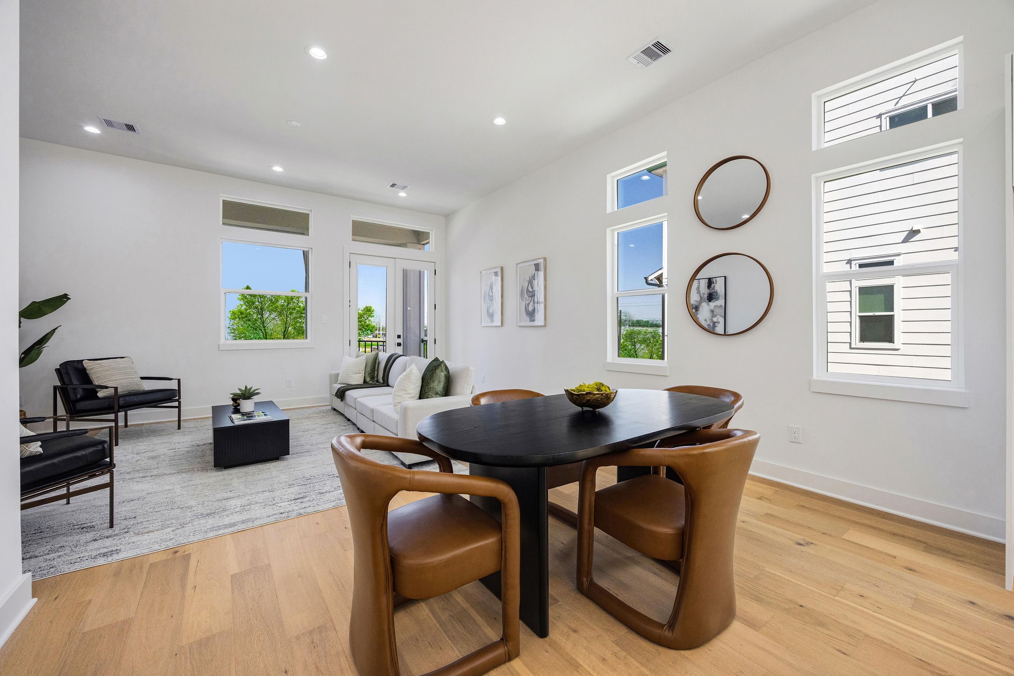 303 Marcella Street, Unit O Houston, TX 77091 - Photo 11 of 26 View of the dining area seamlessly connected to the living room and balcony perfect for entertaining and family gatherings.