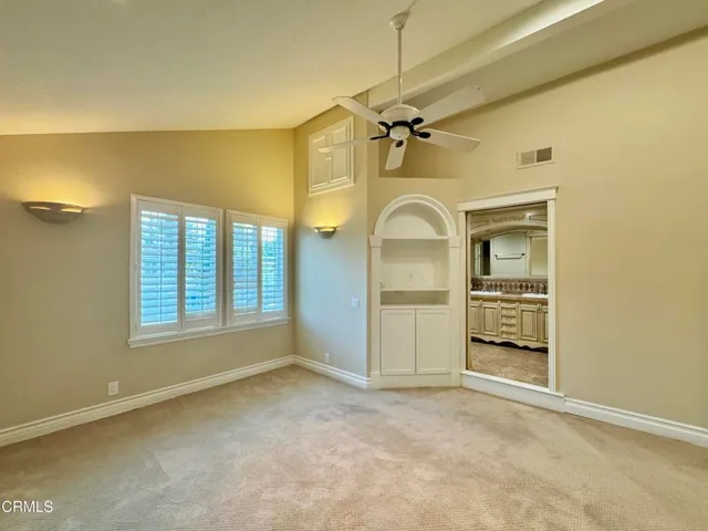 a spacious bathroom with a sink mirror and a bath tub