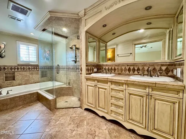 a bathroom with a bathtub and a shower