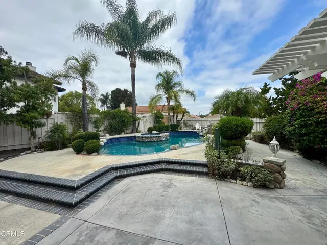 a view of a swimming pool with a patio