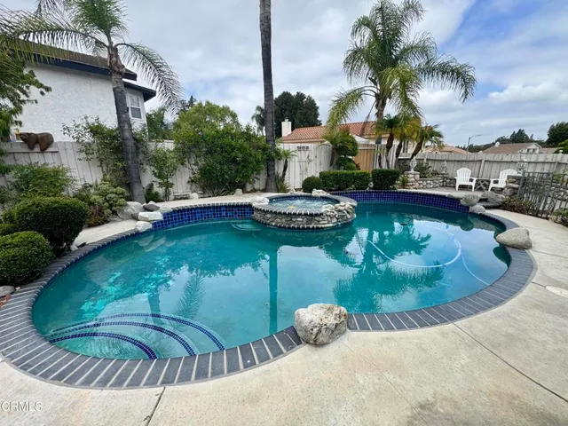 a view of a chairs and table in the patio