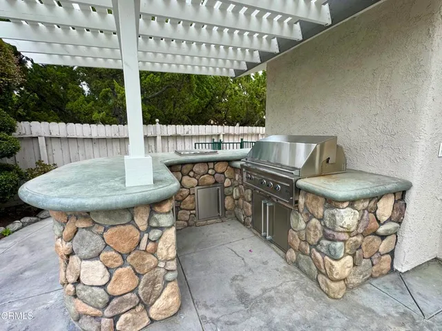 a view of a chairs and table in a patio