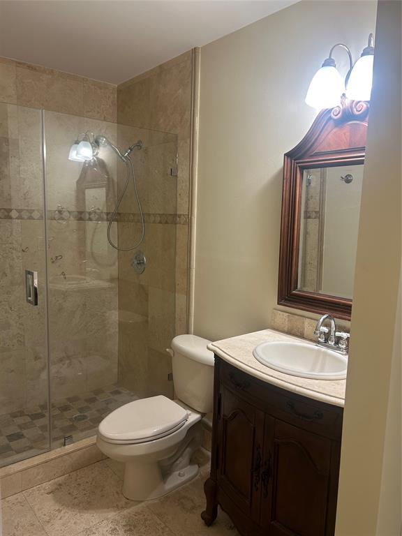 4116 Northwest 88th Avenue, Unit 202 Coral Springs, FL 33065 - Photo 14 of 16 a bathroom with a sink a toilet and shower