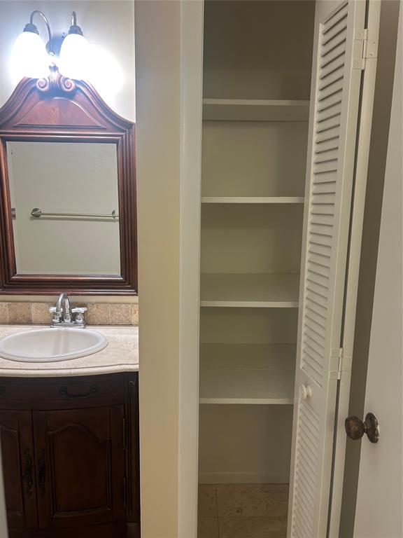 4116 Northwest 88th Avenue, Unit 202 Coral Springs, FL 33065 - Photo 15 of 16 a bathroom with a sink and a mirror