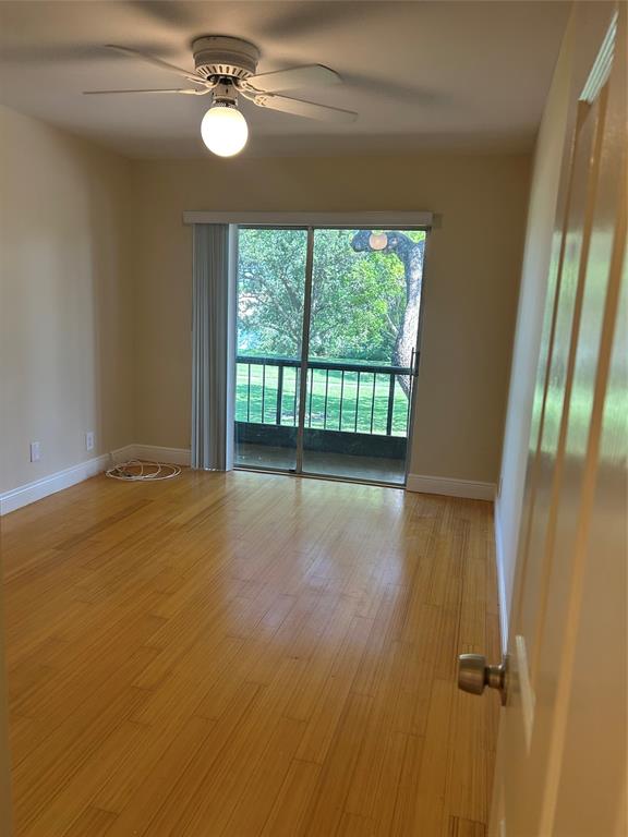 4116 Northwest 88th Avenue, Unit 202 Coral Springs, FL 33065 - Photo 8 of 16 a view of an empty room with a window