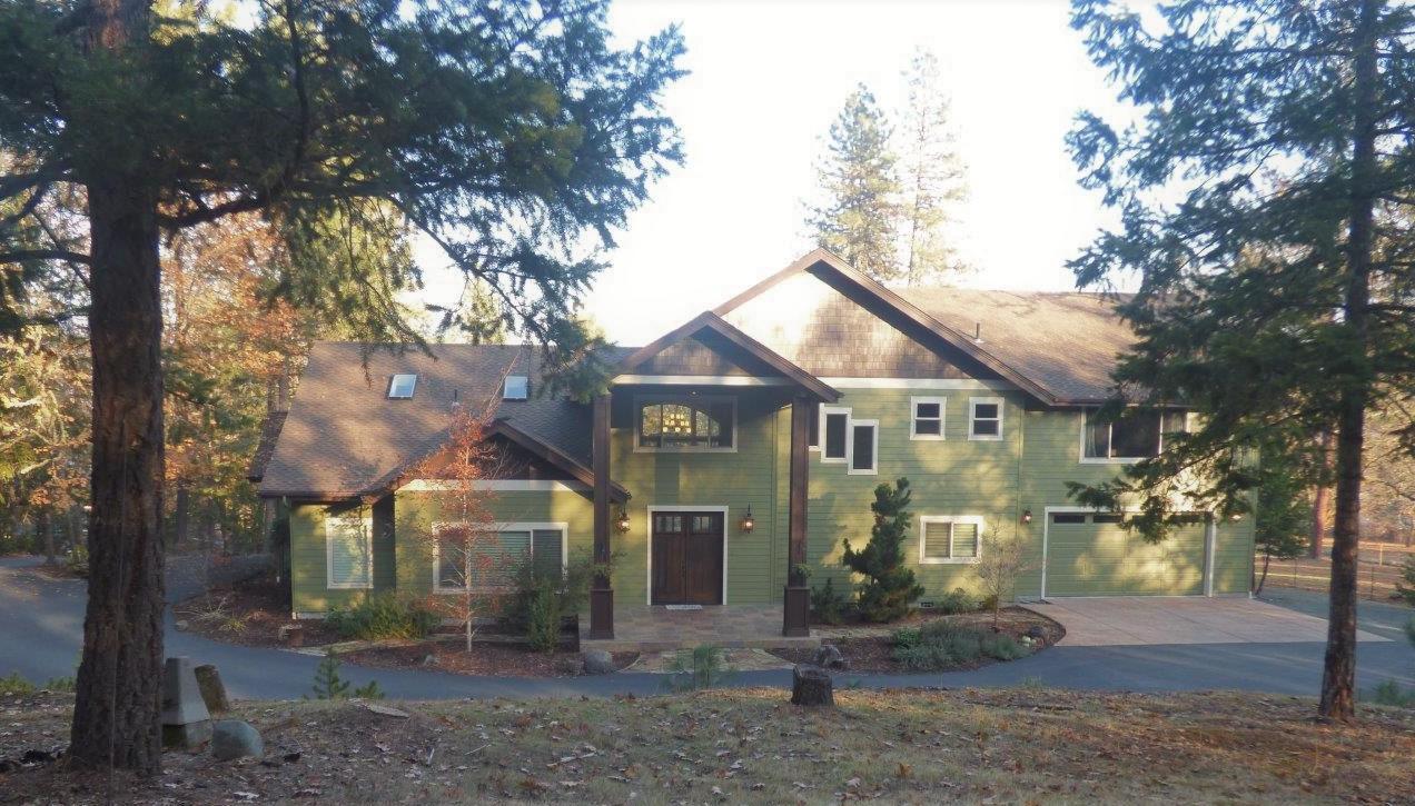 2144 Southwest Allen Creek Road Grants Pass, OR 97527 - Photo 2 of 55 Surrounded by trees this country home, is in the District 7 School zone and Urban growth area.