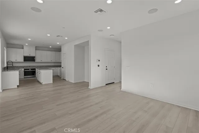 a view of kitchen with wooden floor