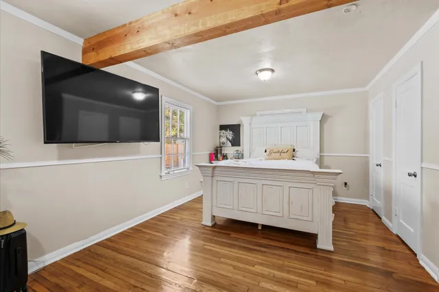 a view of living room with wooden floor
