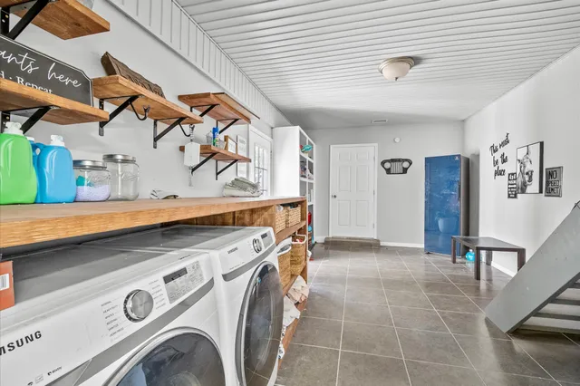 a utility room with dryer and washer