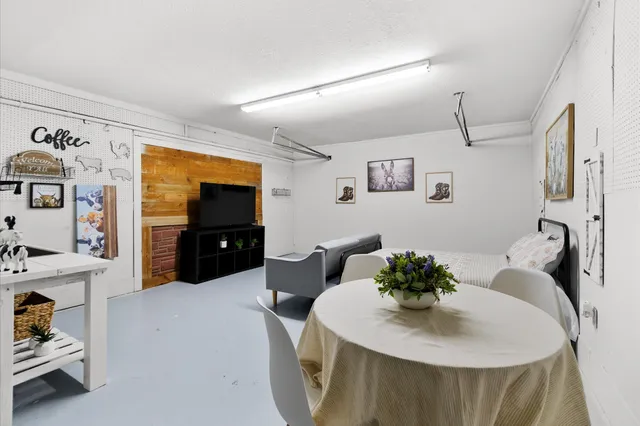 a dining room with furniture and window