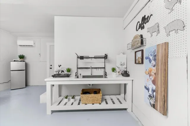 a white cabinet sitting next to a white cabinet