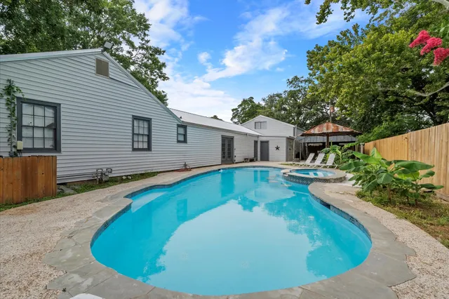 a view of a house with swimming pool
