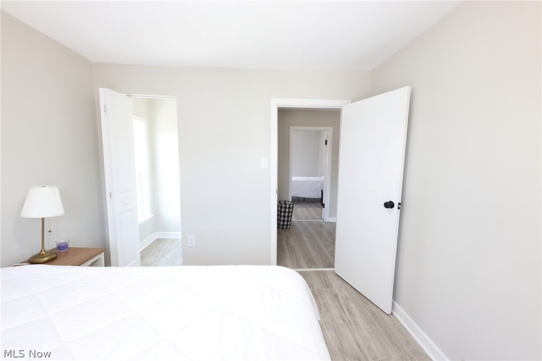 416 5th Street Chester, WV 26034 - Photo 14 of 24 Interior room featuring light gray walls and wood-finish flooring