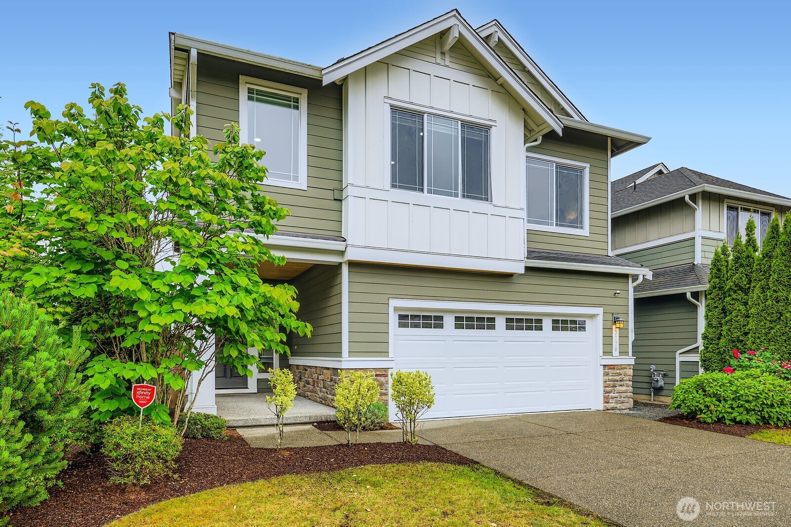 3720 195th Place Southeast Bothell, WA 98012 - Photo 2 of 32 a front view of a house with garden