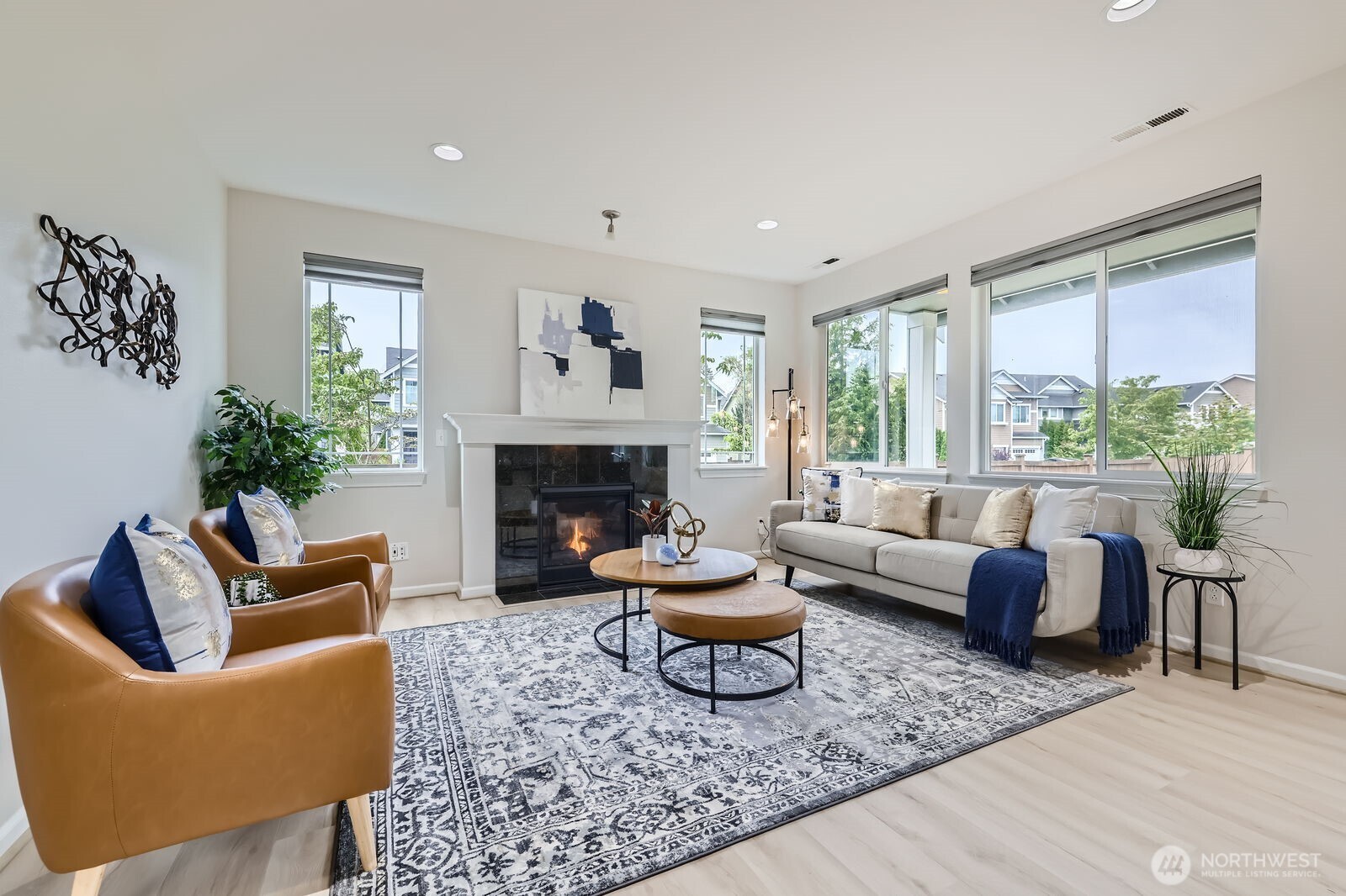3720 195th Place Southeast Bothell, WA 98012 - Photo 5 of 32 a living room with furniture a fireplace and a large window