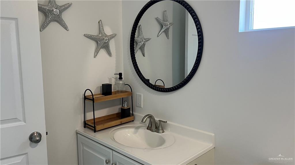318 Sun Dial Circle Port Isabel, TX 78578 - Photo 14 of 19 a bathroom with a sink and a mirror