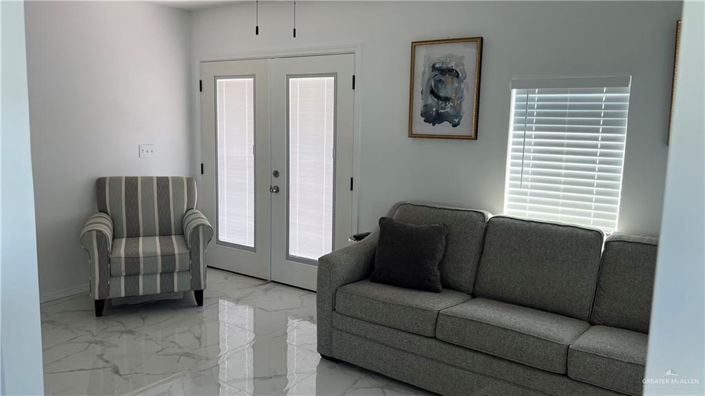 318 Sun Dial Circle Port Isabel, TX 78578 - Photo 4 of 19 a living room with furniture and a window