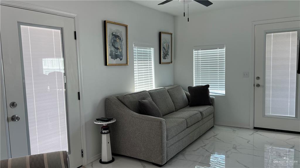 318 Sun Dial Circle Port Isabel, TX 78578 - Photo 5 of 19 a living room with furniture and a window