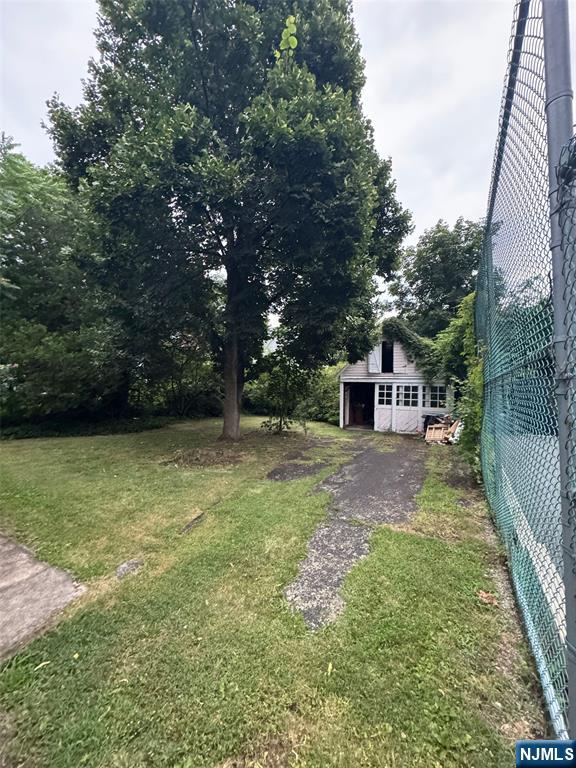 103 Sylvan Street Rutherford, NJ 07070 - Photo 6 of 8 a view of a backyard with large trees
