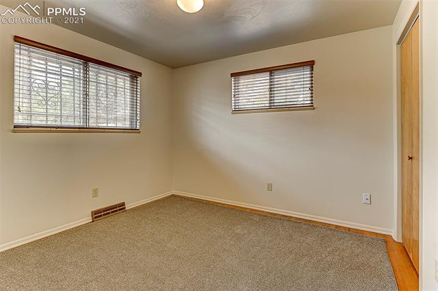 18 North Chelton Road Colorado Springs, CO 80909 - Photo 14 of 32 main level bed