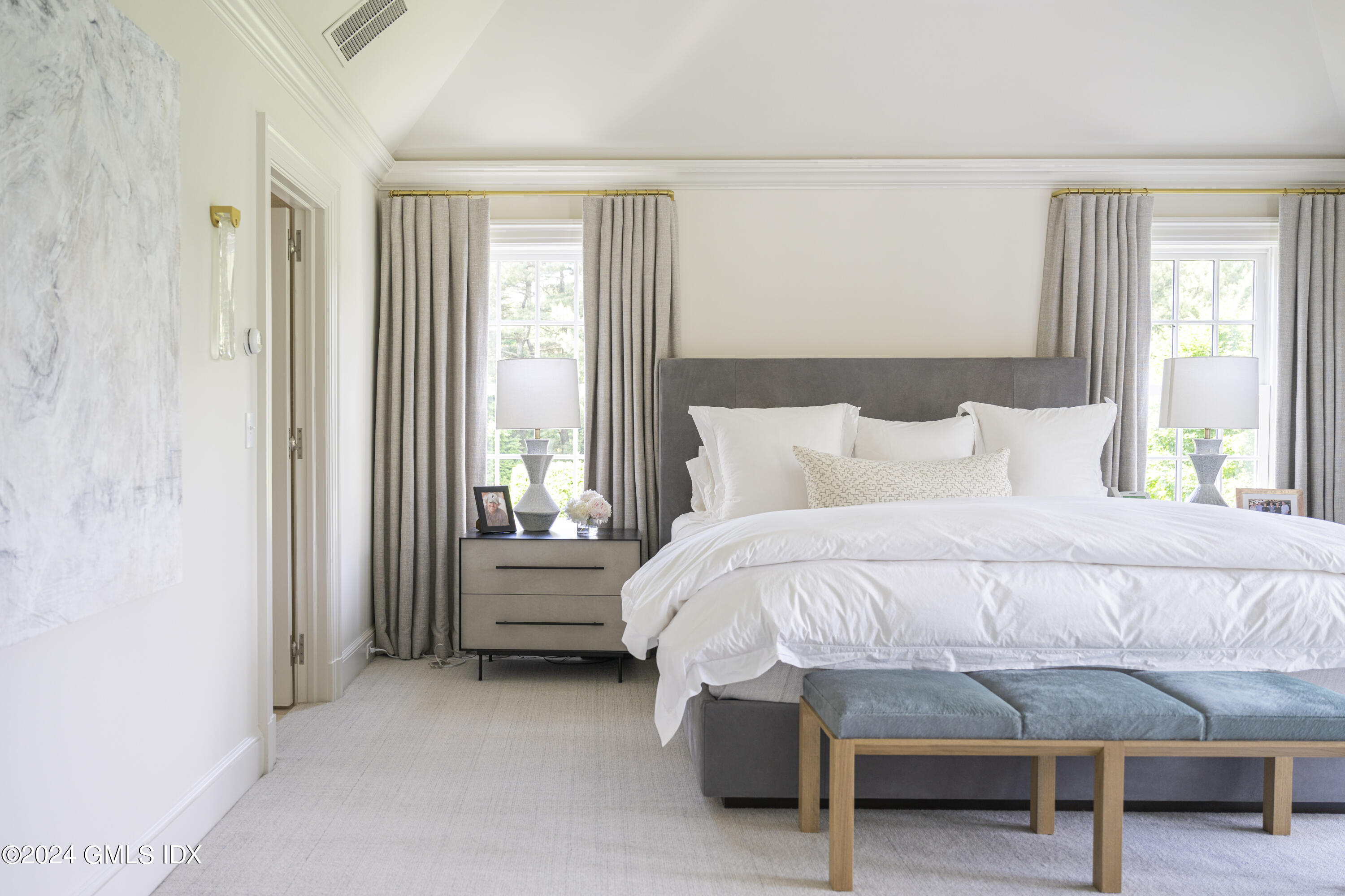 865 Hollow Tree Ridge Road Darien, CT 06820 - Photo 15 of 37 a bedroom with a bed and a table