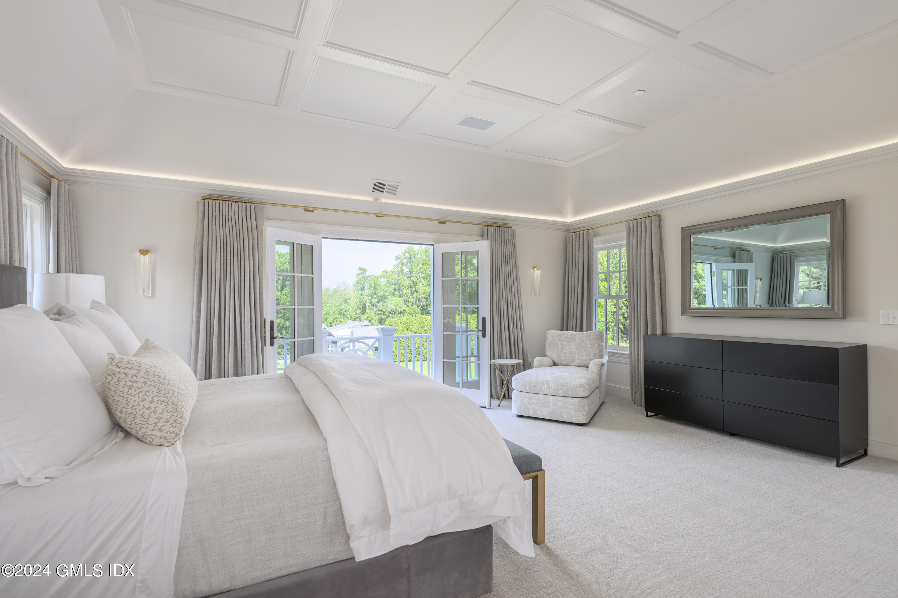 865 Hollow Tree Ridge Road Darien, CT 06820 - Photo 16 of 37 a bedroom with a bed and a couch