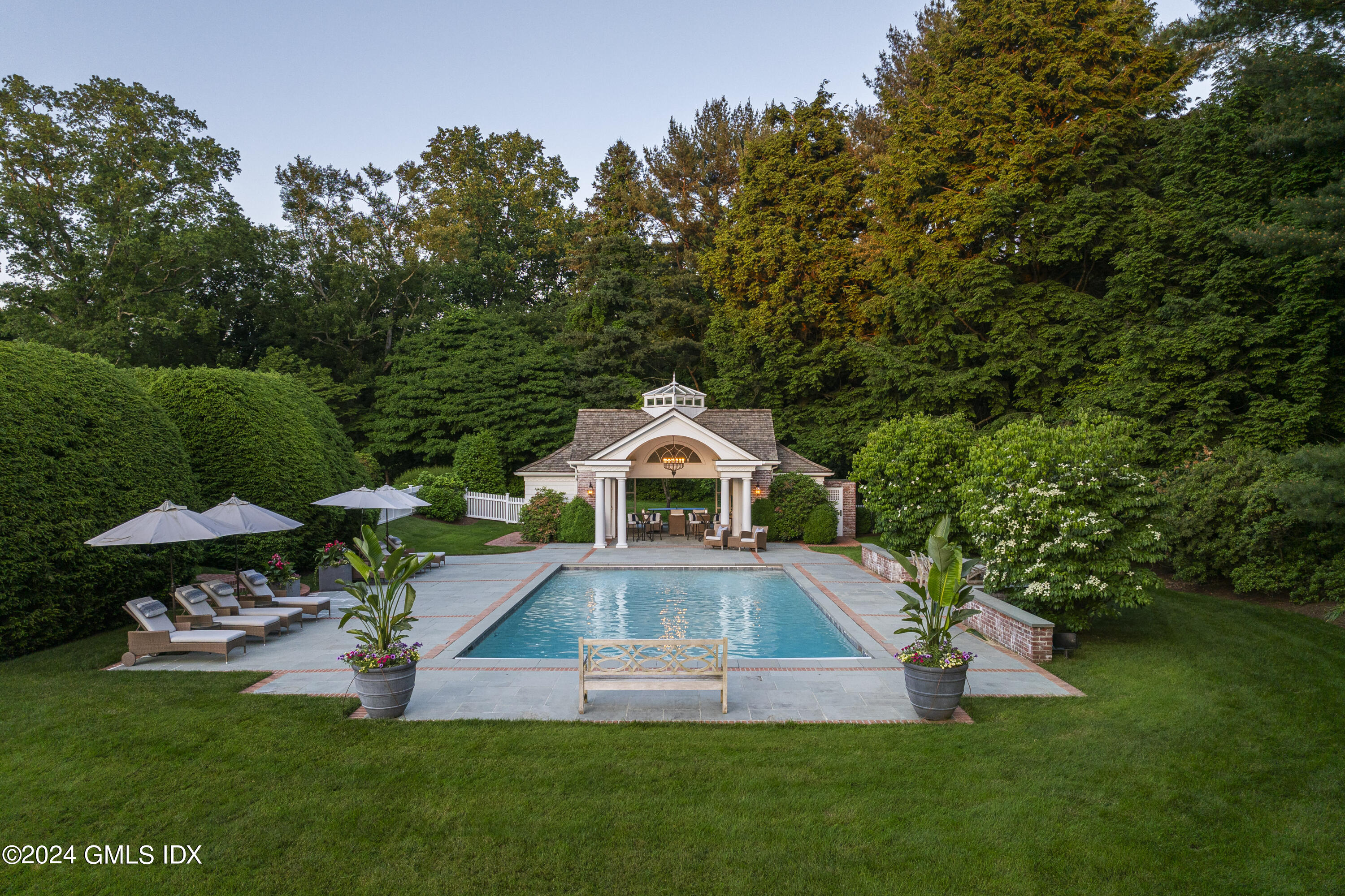 865 Hollow Tree Ridge Road Darien, CT 06820 - Photo 20 of 37 a front view of a house with a yard