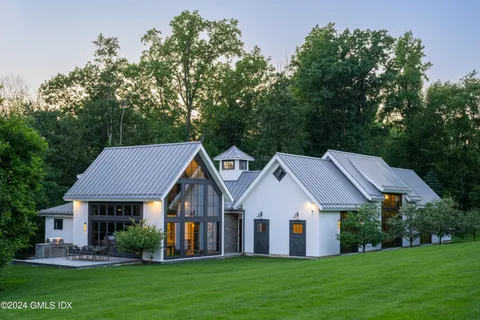 a front view of a house with a garden and porch